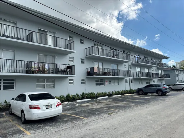 a car parked in front of a building