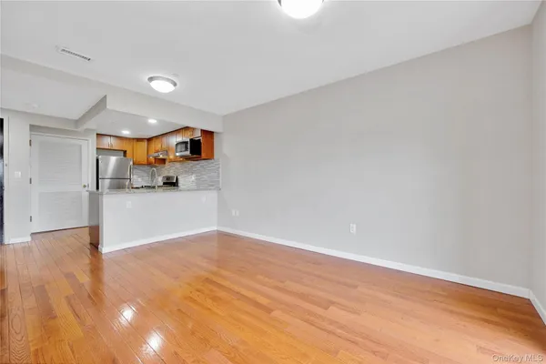 a view of a kitchen with a sink and cabinets