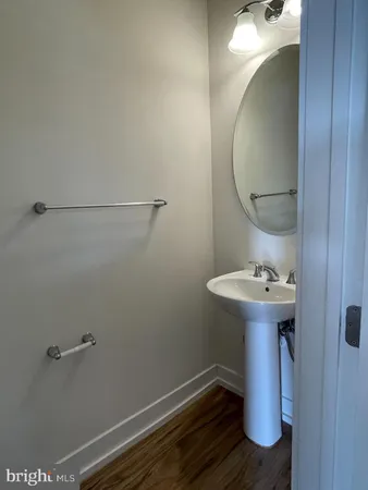 a bathroom with a sink and mirror