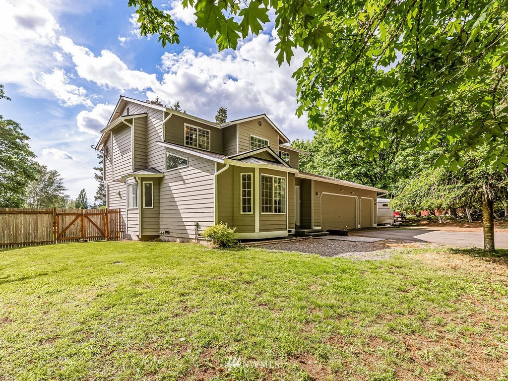 3220 228th Street Southeast Bothell, WA 98021 - Photo 2 of 35 a view of a house with a yard and pathway
