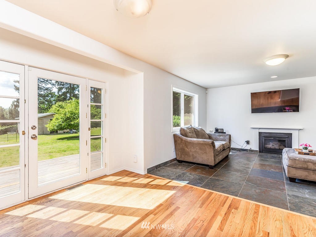 3220 228th Street Southeast Bothell, WA 98021 - Photo 11 of 35 a bedroom with furniture and a large window