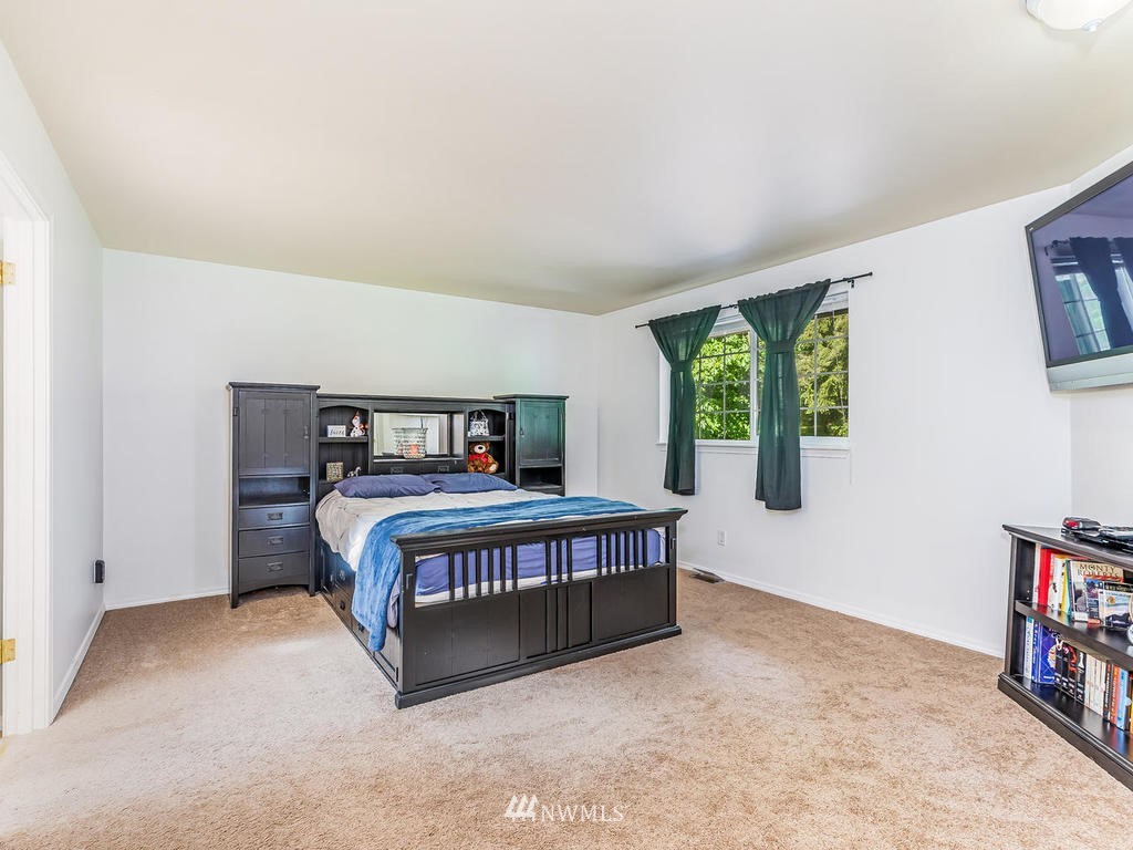 3220 228th Street Southeast Bothell, WA 98021 - Photo 16 of 35 a bedroom with a bed and a window