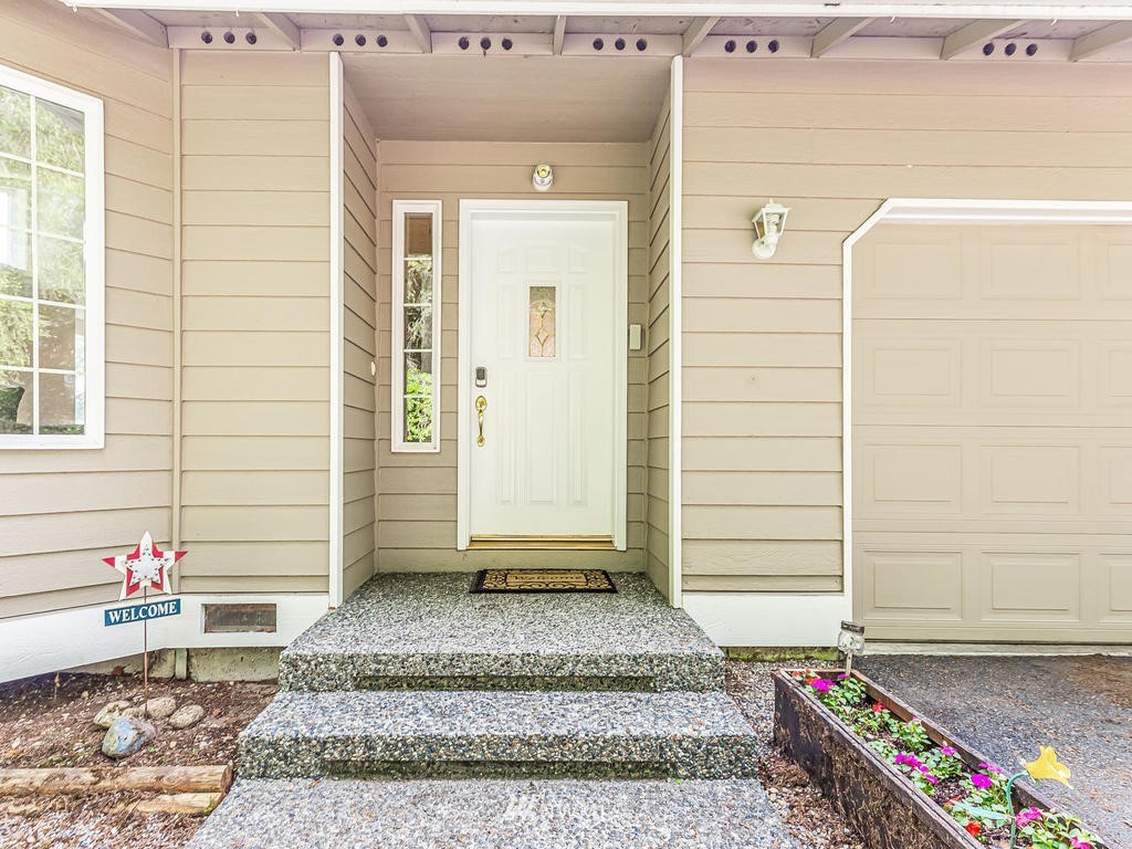 3220 228th Street Southeast Bothell, WA 98021 - Photo 3 of 35 a view of a entryway door front of house
