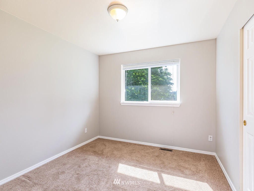 3220 228th Street Southeast Bothell, WA 98021 - Photo 21 of 35 an empty room with a window