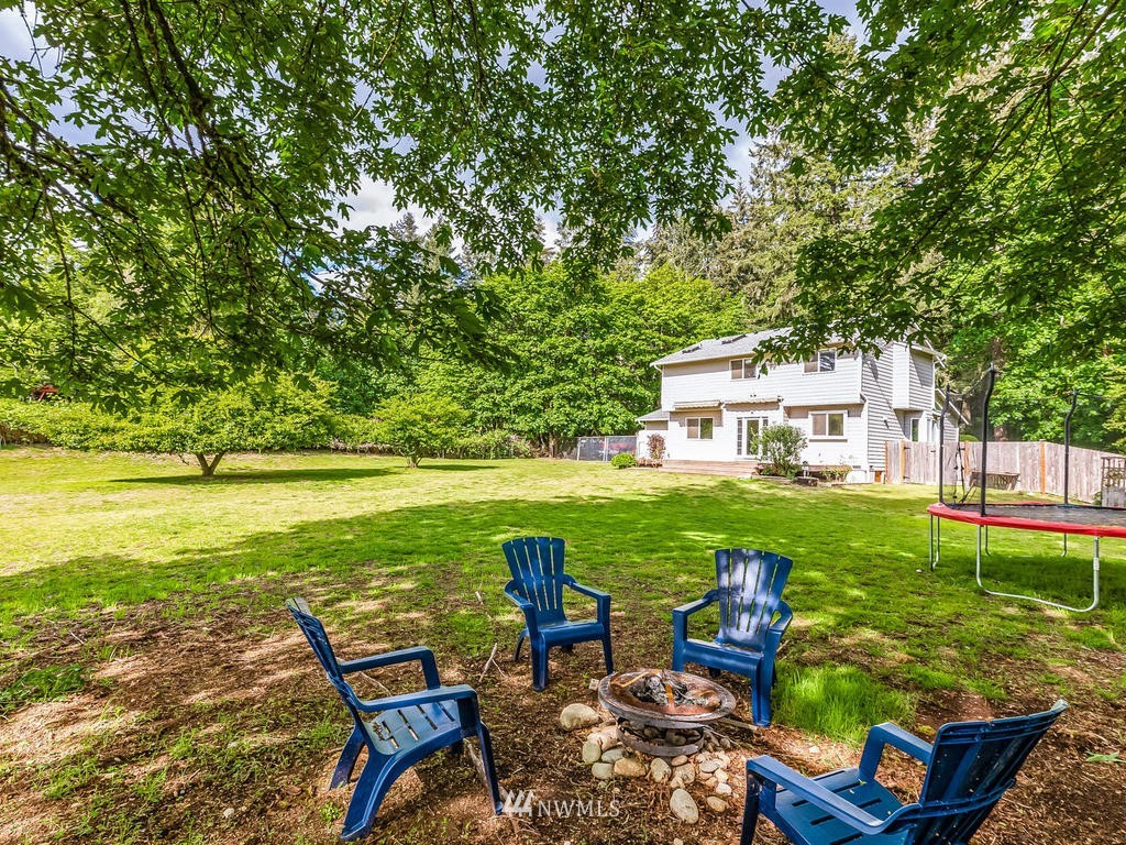 3220 228th Street Southeast Bothell, WA 98021 - Photo 26 of 35 a view of a swimming pool with a patio and a yard