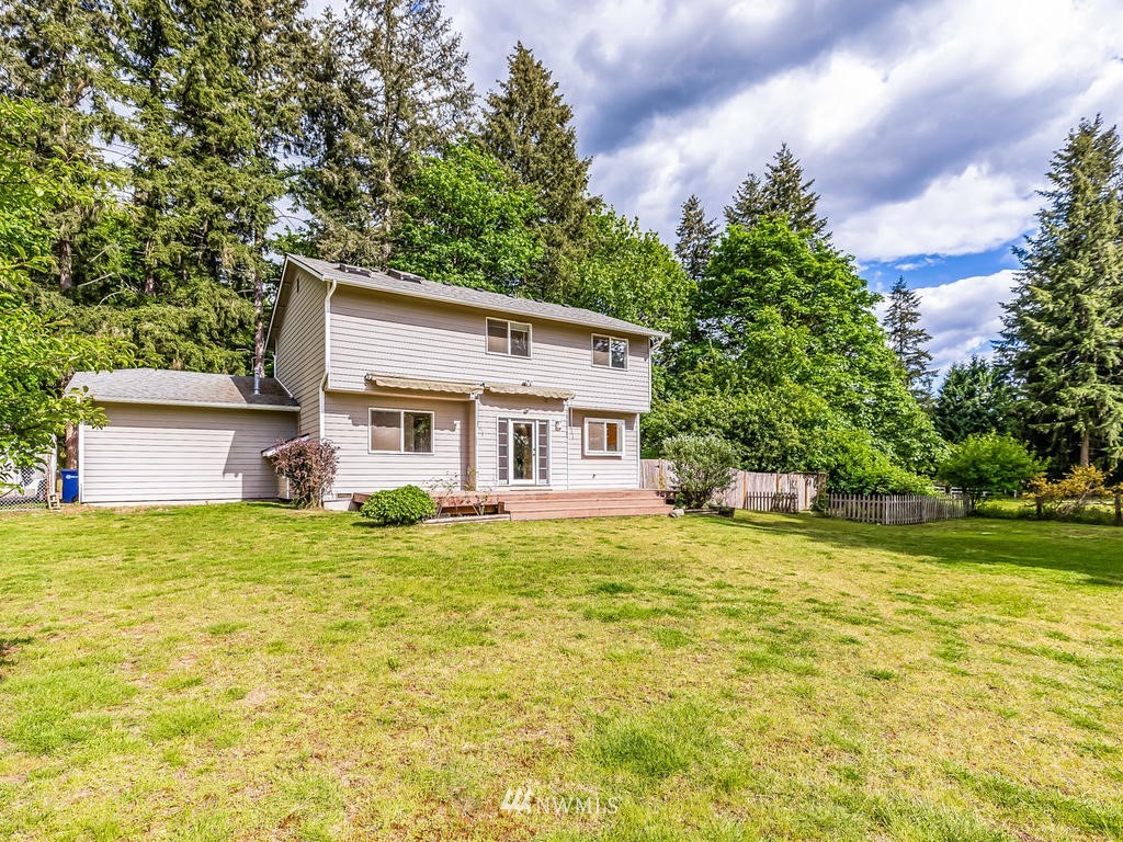 3220 228th Street Southeast Bothell, WA 98021 - Photo 27 of 35 front view of a house with a yard