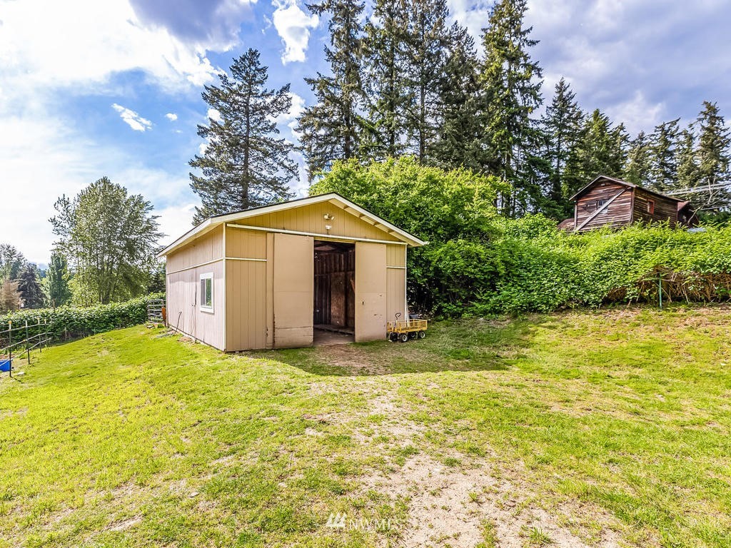 3220 228th Street Southeast Bothell, WA 98021 - Photo 29 of 35 a view of a house with a yard