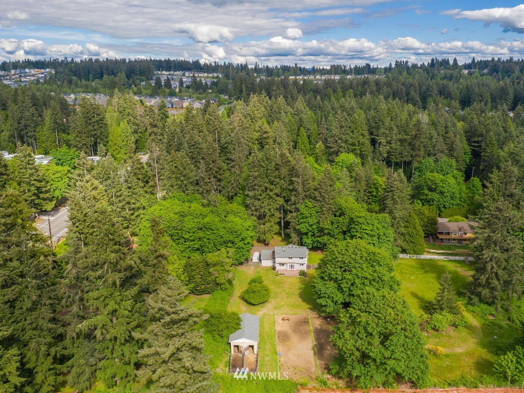 3220 228th Street Southeast Bothell, WA 98021 - Photo 35 of 35 a view of a lake with houses in the back