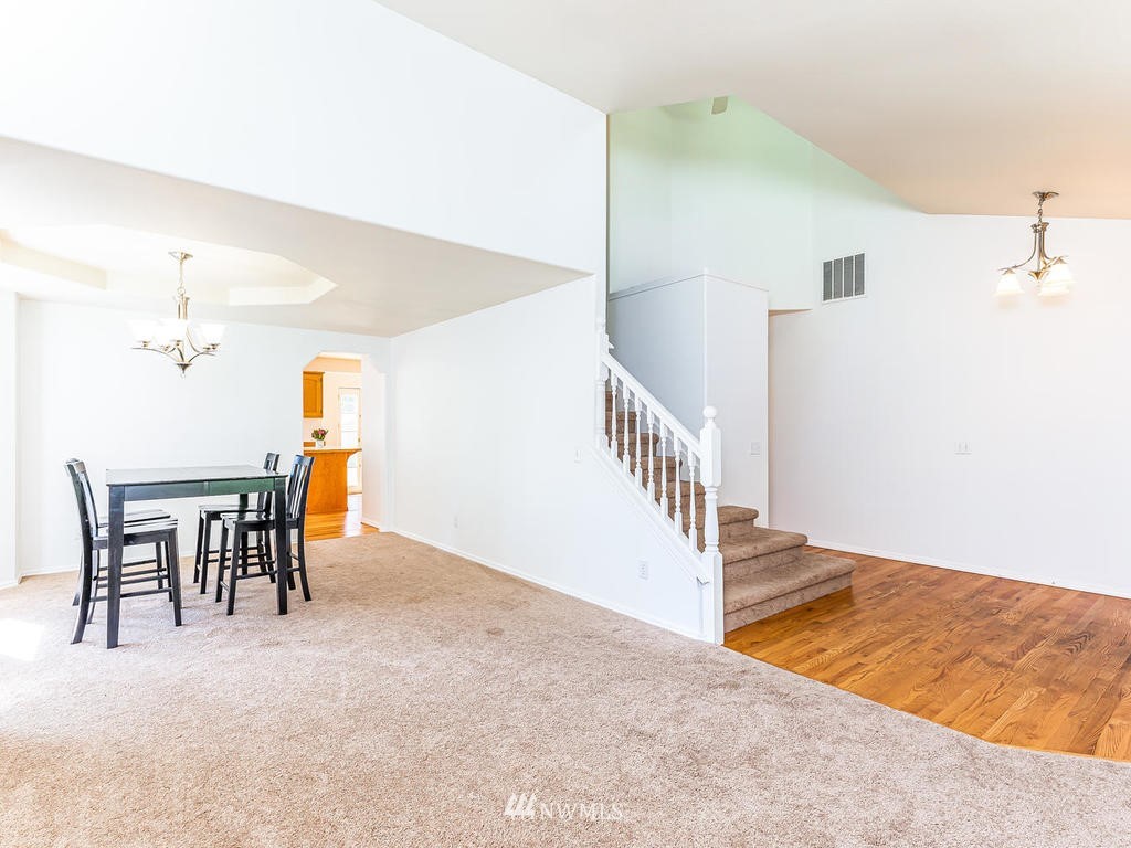 3220 228th Street Southeast Bothell, WA 98021 - Photo 5 of 35 a view of a livingroom with furniture and staircase