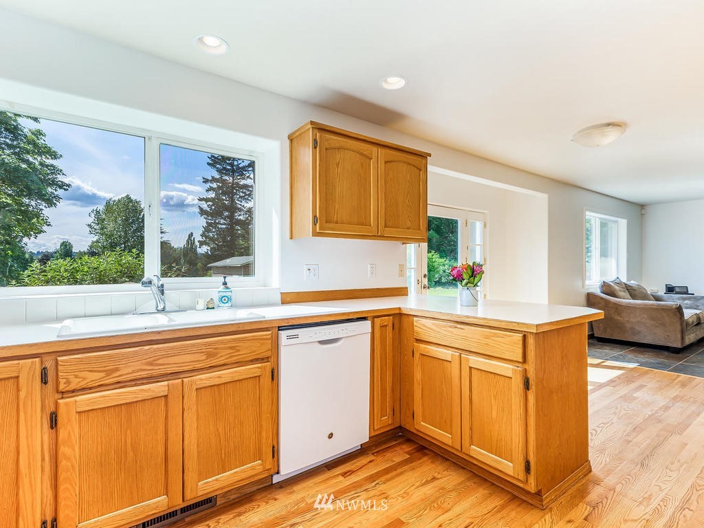 3220 228th Street Southeast Bothell, WA 98021 - Photo 9 of 35 a kitchen with a sink and cabinets