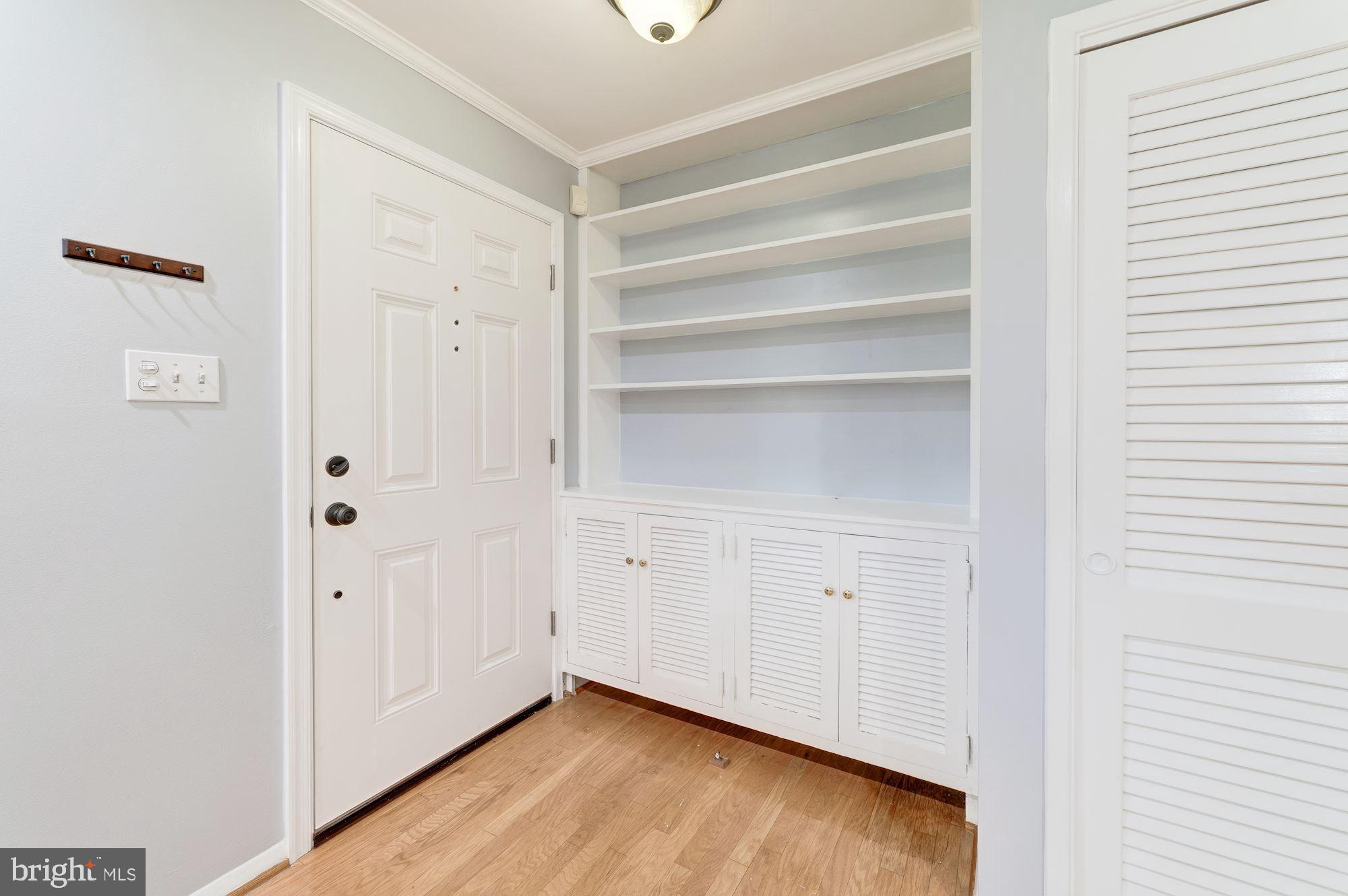 7510 June Street Springfield, VA 22150 - Photo 35 of 44 Built-in shelving and cabinetry at entry