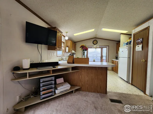 a kitchen with counter space cabinets and appliances