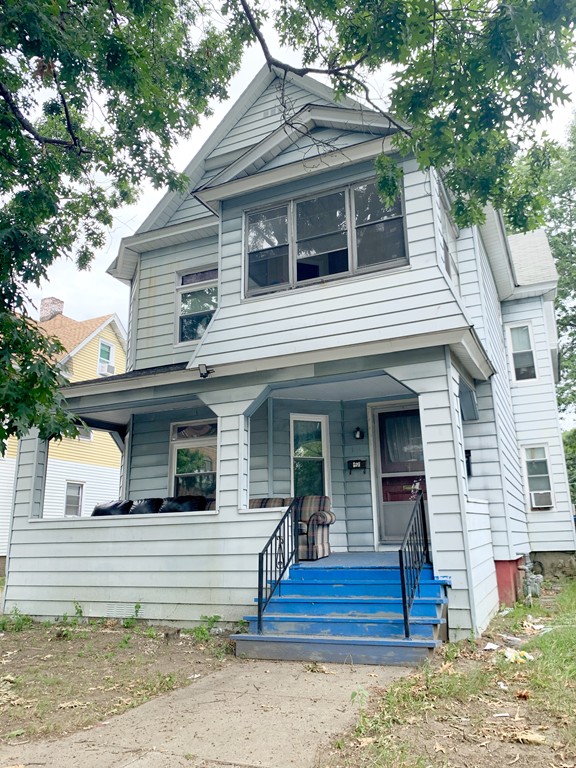 42 Alderman Street Springfield, MA 01108 - Photo 1 of 1 a view of a house with a small yard plants and large tree