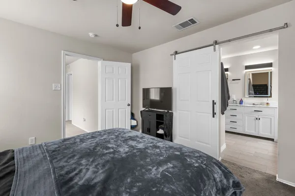 a spacious bathroom with a double vanity sink and a mirror