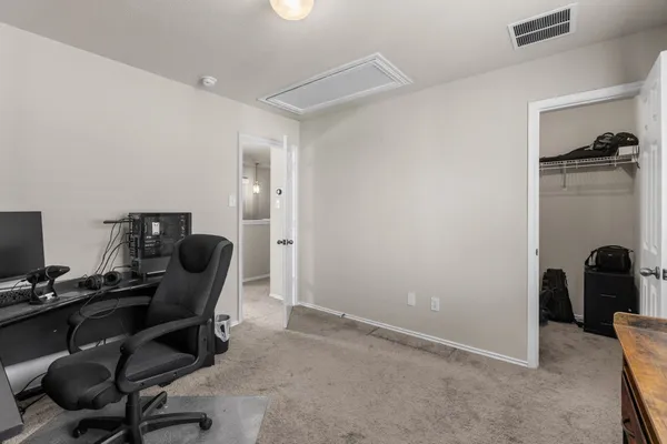 a workspace with furniture and a window