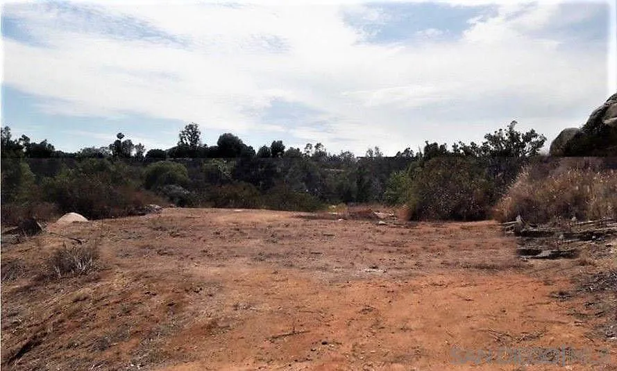 15277 Espola Road, Unit 3 Poway, CA 92064 - Photo 8 of 9 a view of a dry yard with wooden fence