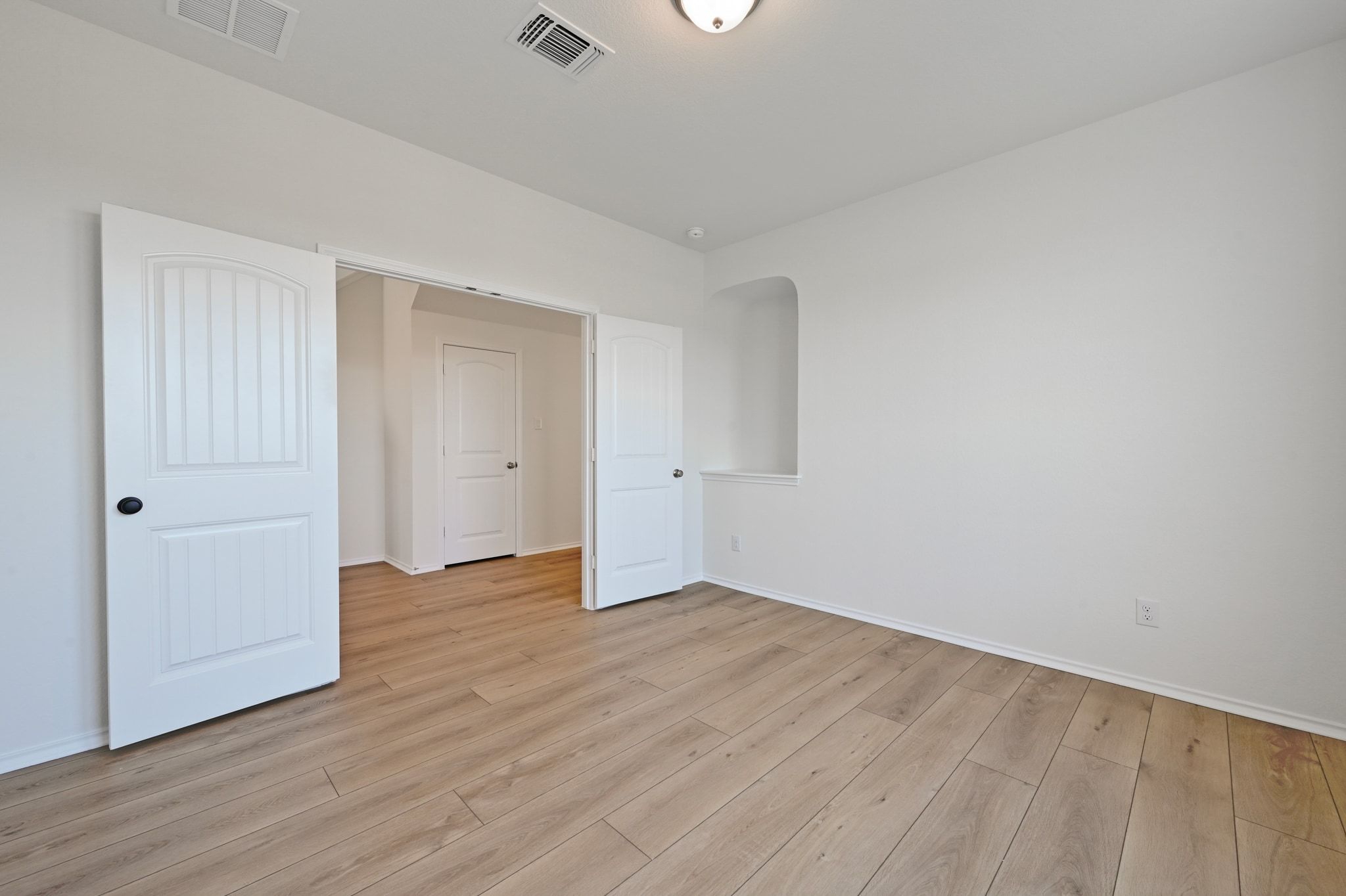 15004 Garrano Way Manor, TX 78653 - Photo 21 of 34 a view of an empty room with wooden floor