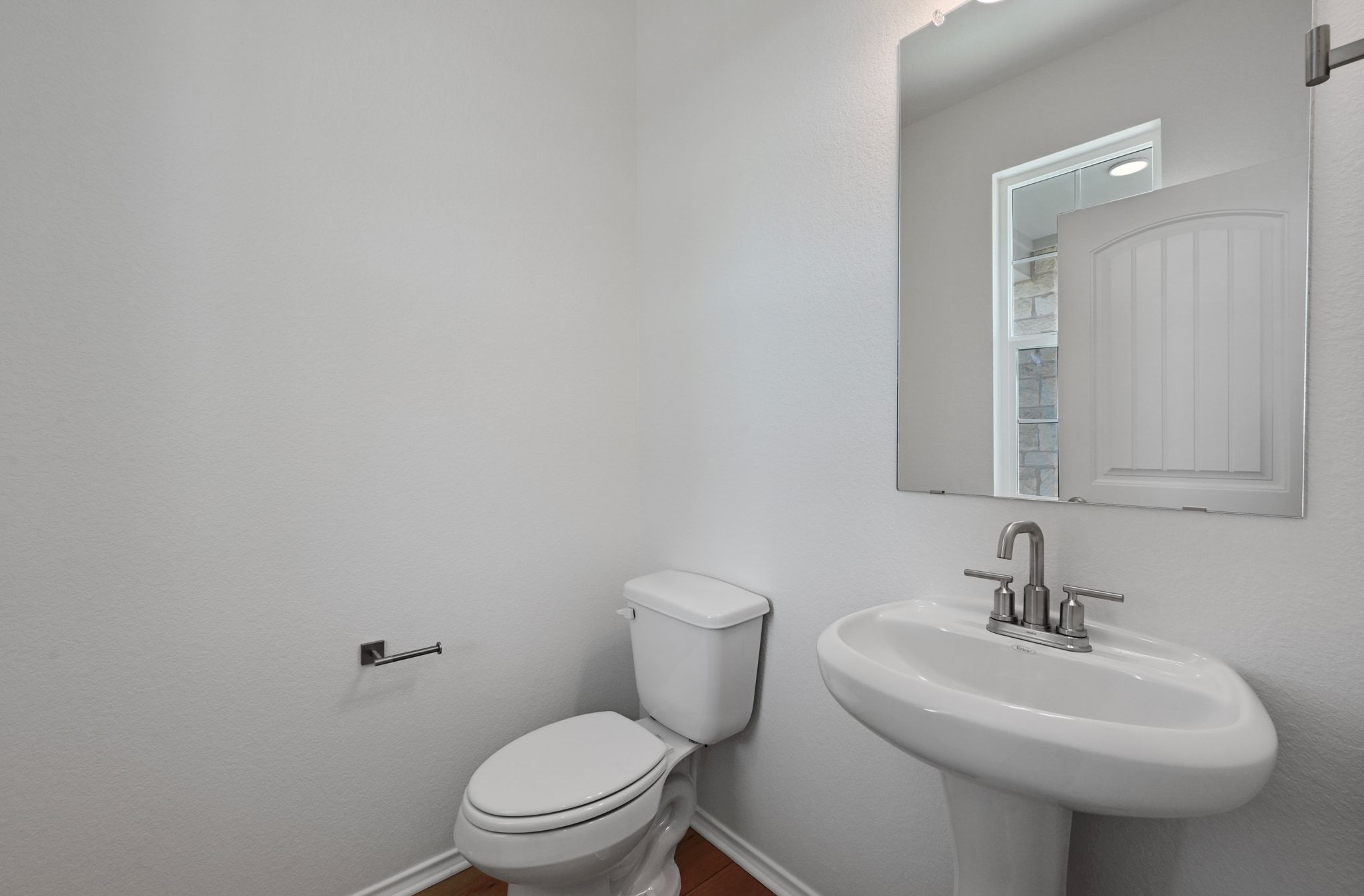15004 Garrano Way Manor, TX 78653 - Photo 22 of 34 a bathroom with a sink a toilet and mirror