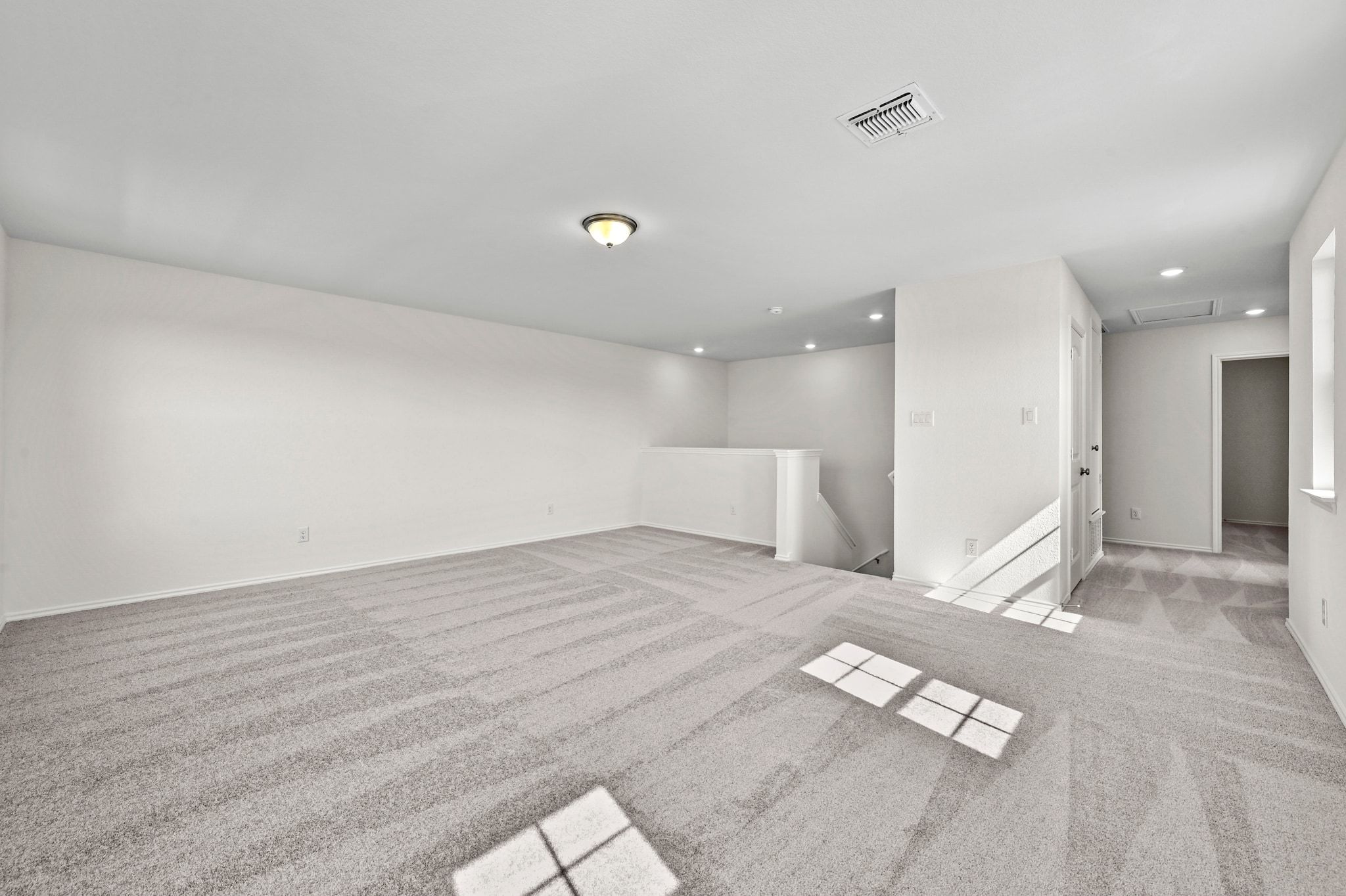 15004 Garrano Way Manor, TX 78653 - Photo 24 of 34 a view of empty room with wooden floor and windows
