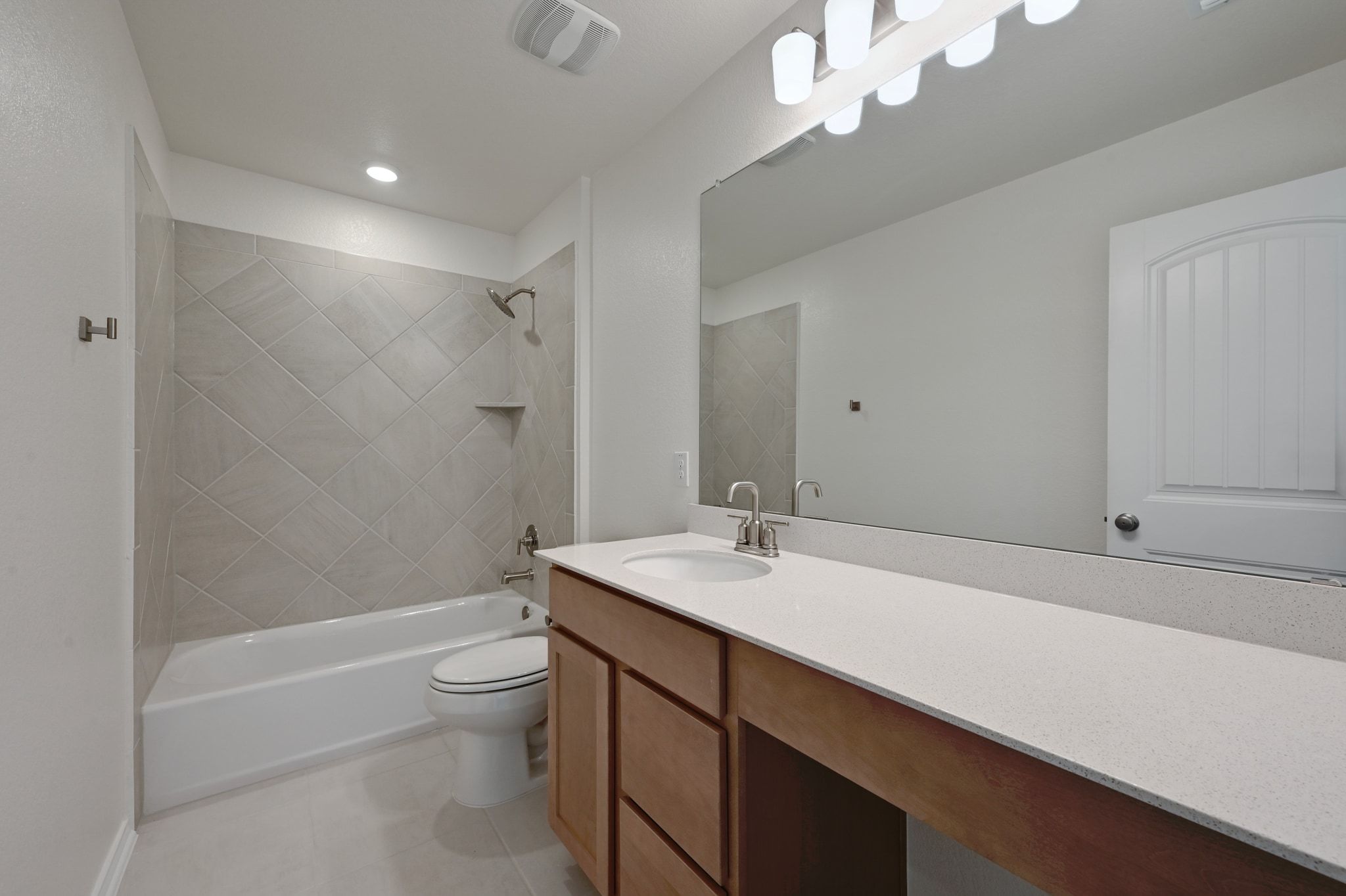 15004 Garrano Way Manor, TX 78653 - Photo 28 of 34 a bathroom with a sink a toilet a mirror and shower