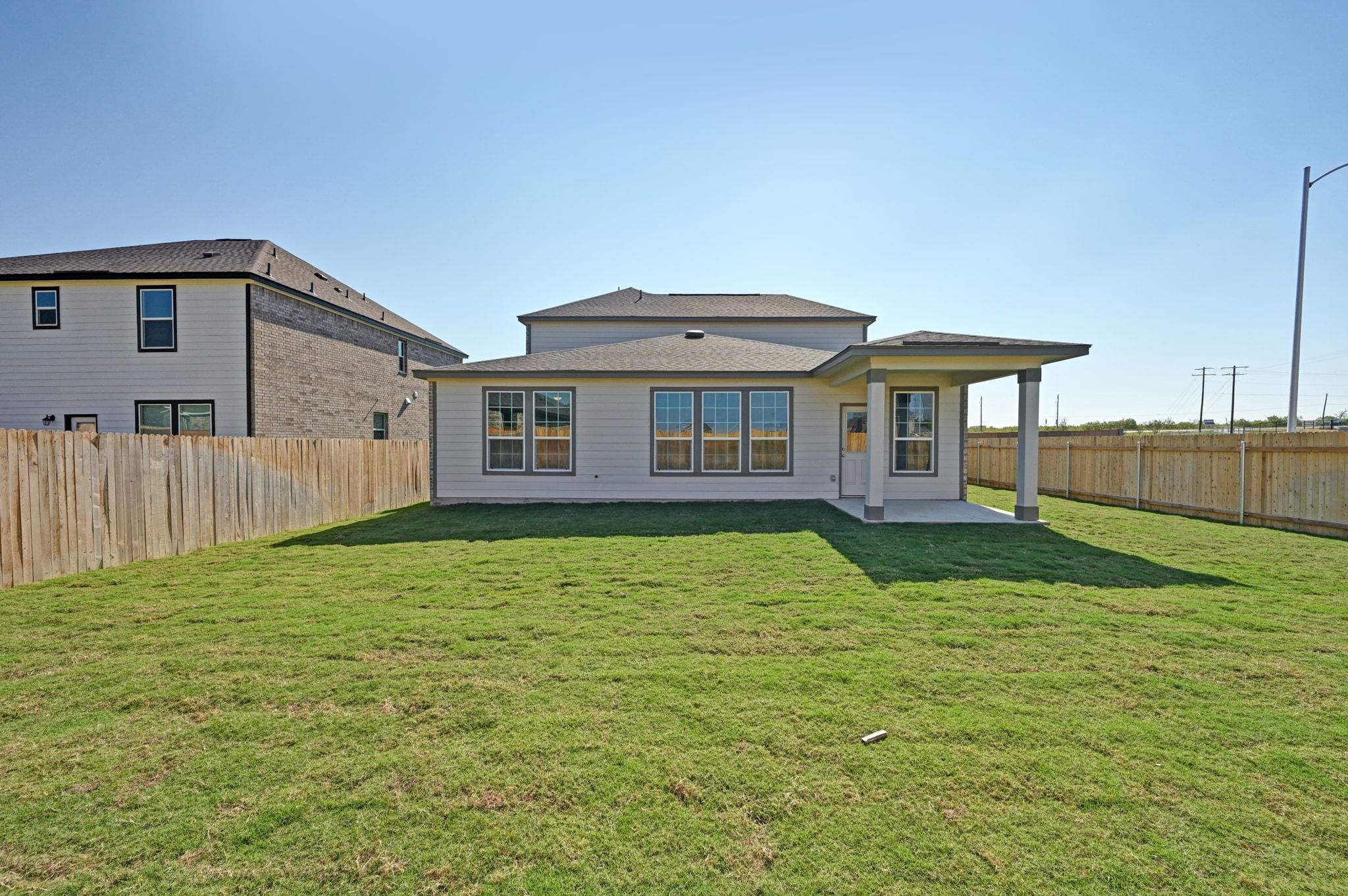 15004 Garrano Way Manor, TX 78653 - Photo 32 of 34 a house view with a garden space
