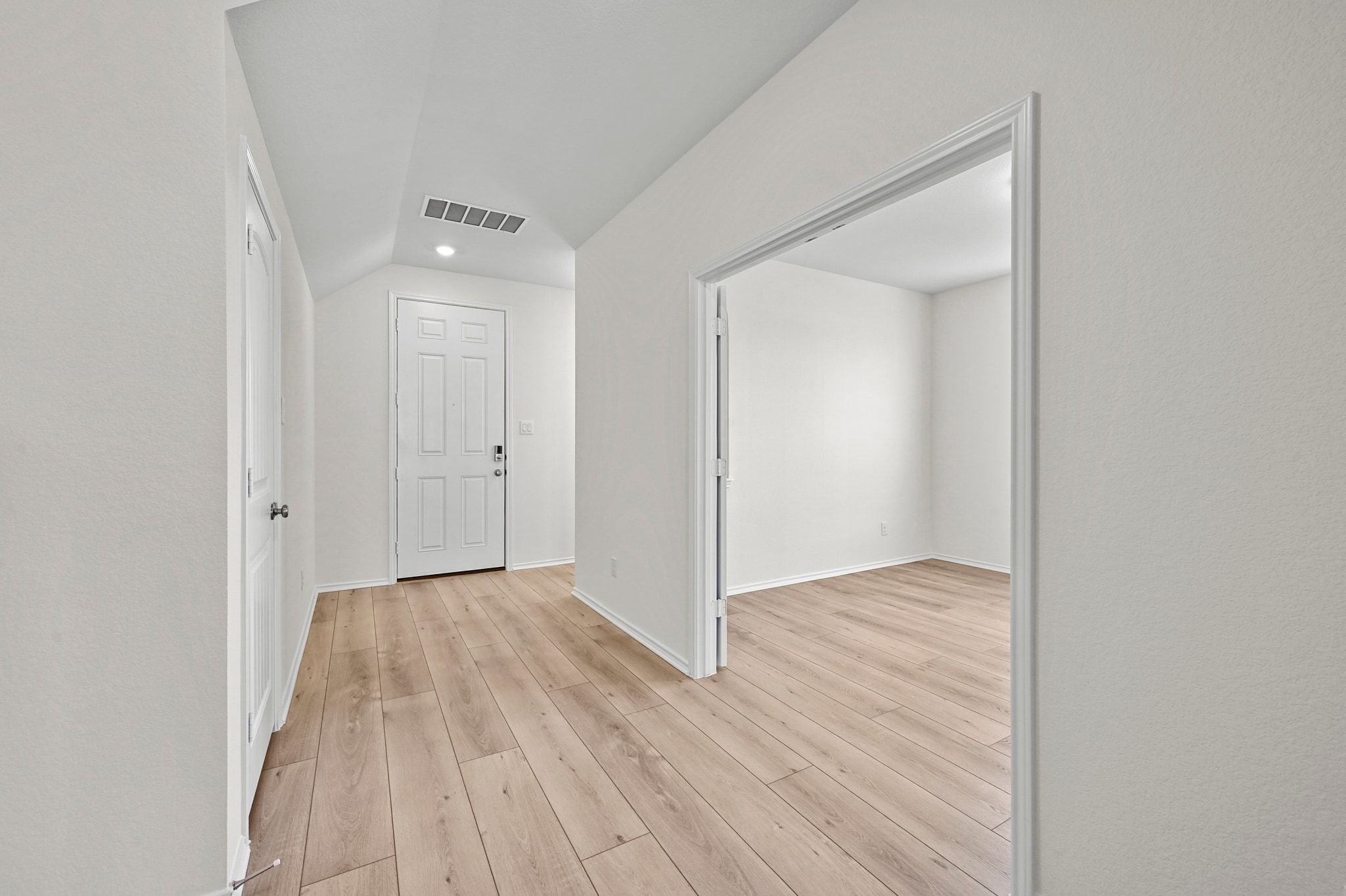 15004 Garrano Way Manor, TX 78653 - Photo 6 of 34 an empty room with wooden floor and closet