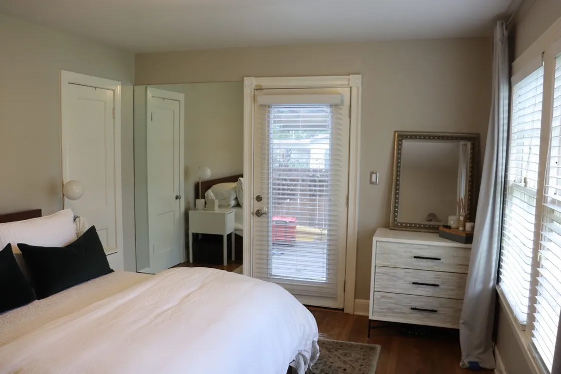 1200 Alegria Road, Unit 1 Austin, TX 78757 - Photo 9 of 16 Primary features wood flooring and access to outside deck.