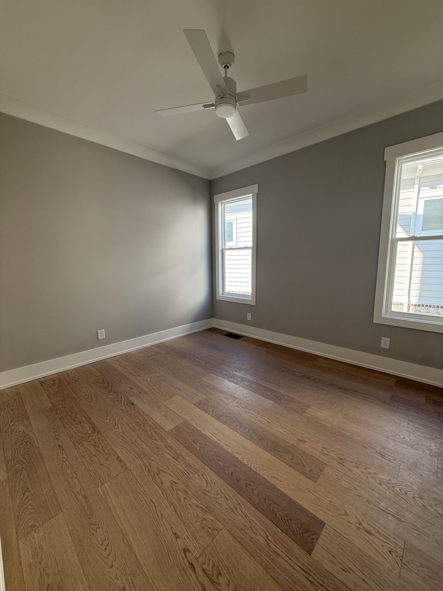 1006 Legrand Avenue Franklin, TN 37064 - Photo 10 of 23 an empty room with wooden floor and windows