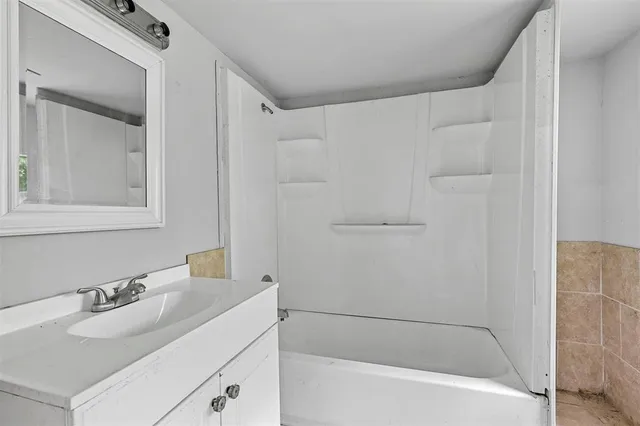 a bathroom with a sink and a bathtub