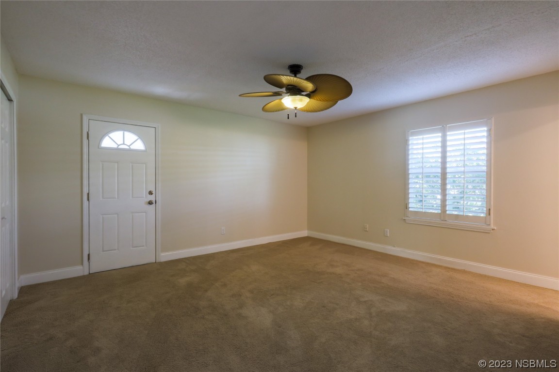 14 Chip Lane New Smyrna Beach, FL 32168 - Photo 13 of 54 an empty room with a window