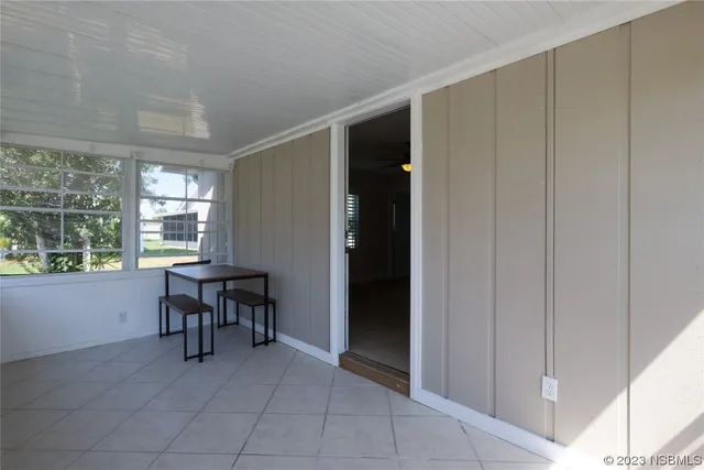 a view of dining room with furniture and window