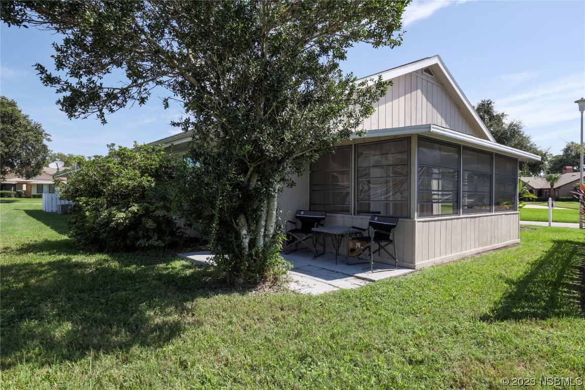 14 Chip Lane New Smyrna Beach, FL 32168 - Photo 23 of 54 a view of house with a yard and sitting area