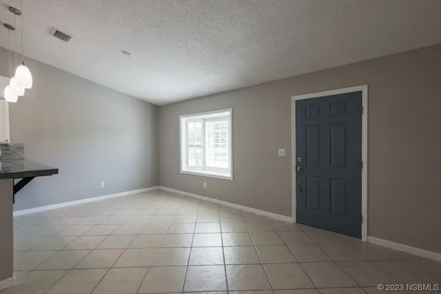 a view of a kitchen with a sink and cabinets