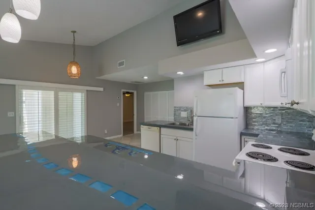 a view of storage and utility room with washer and dryer