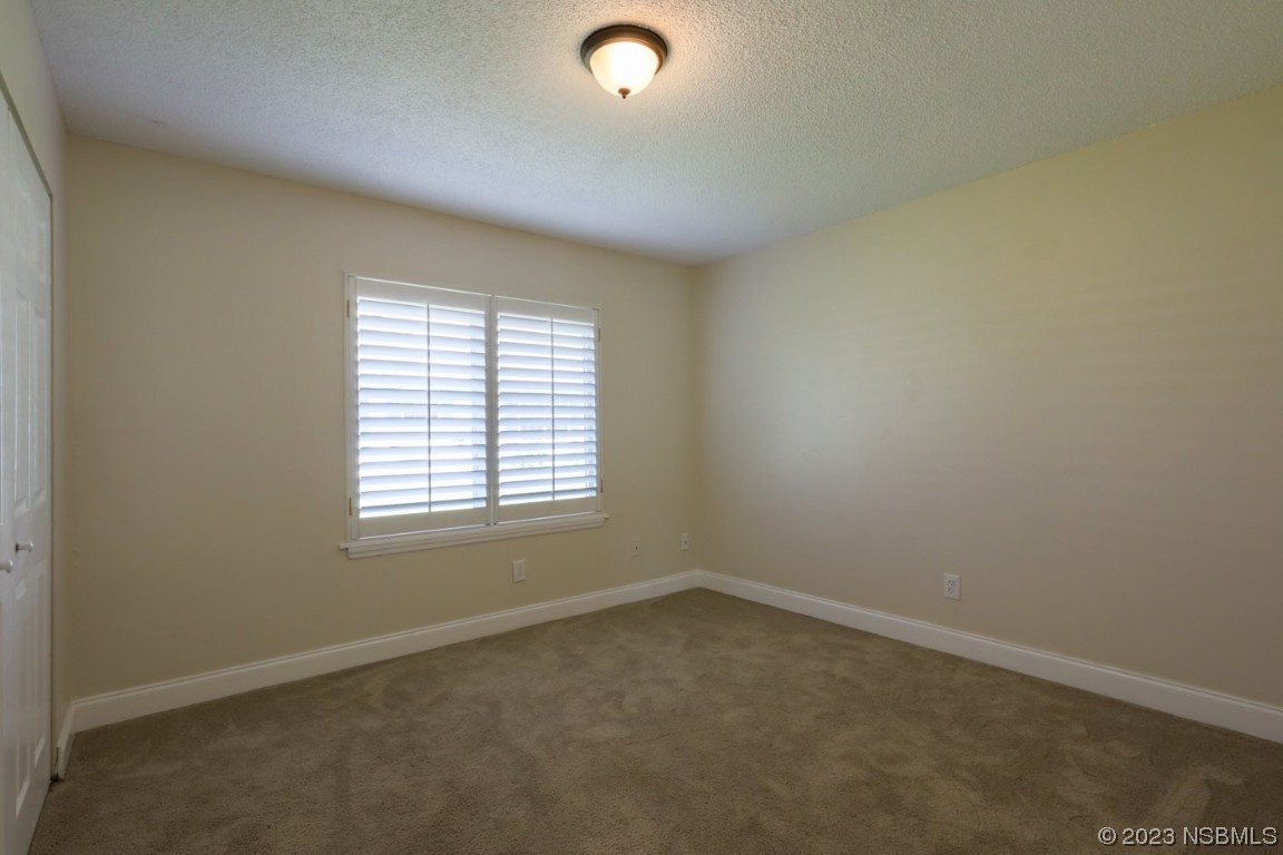 14 Chip Lane New Smyrna Beach, FL 32168 - Photo 46 of 54 an empty room with a window