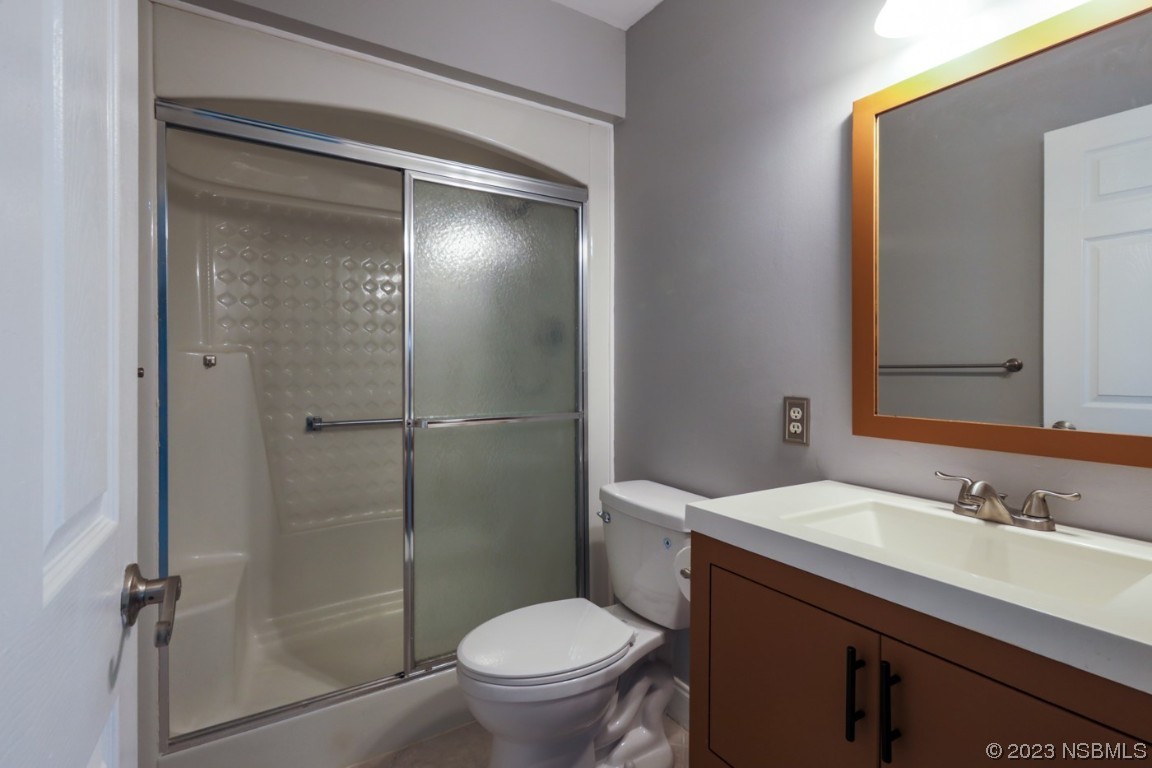 14 Chip Lane New Smyrna Beach, FL 32168 - Photo 48 of 54 a bathroom with a sink toilet and shower