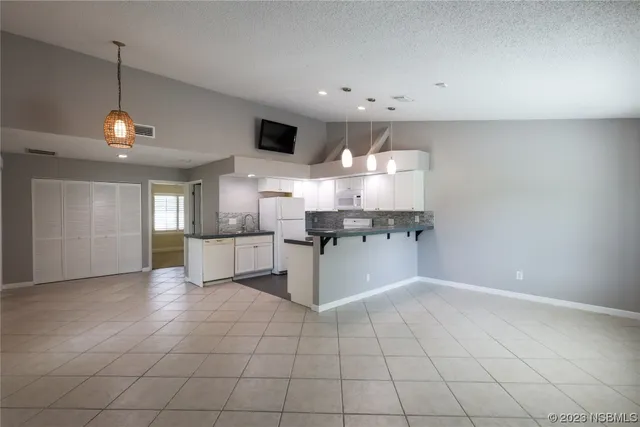 a kitchen with stainless steel appliances granite countertop a sink and cabinets