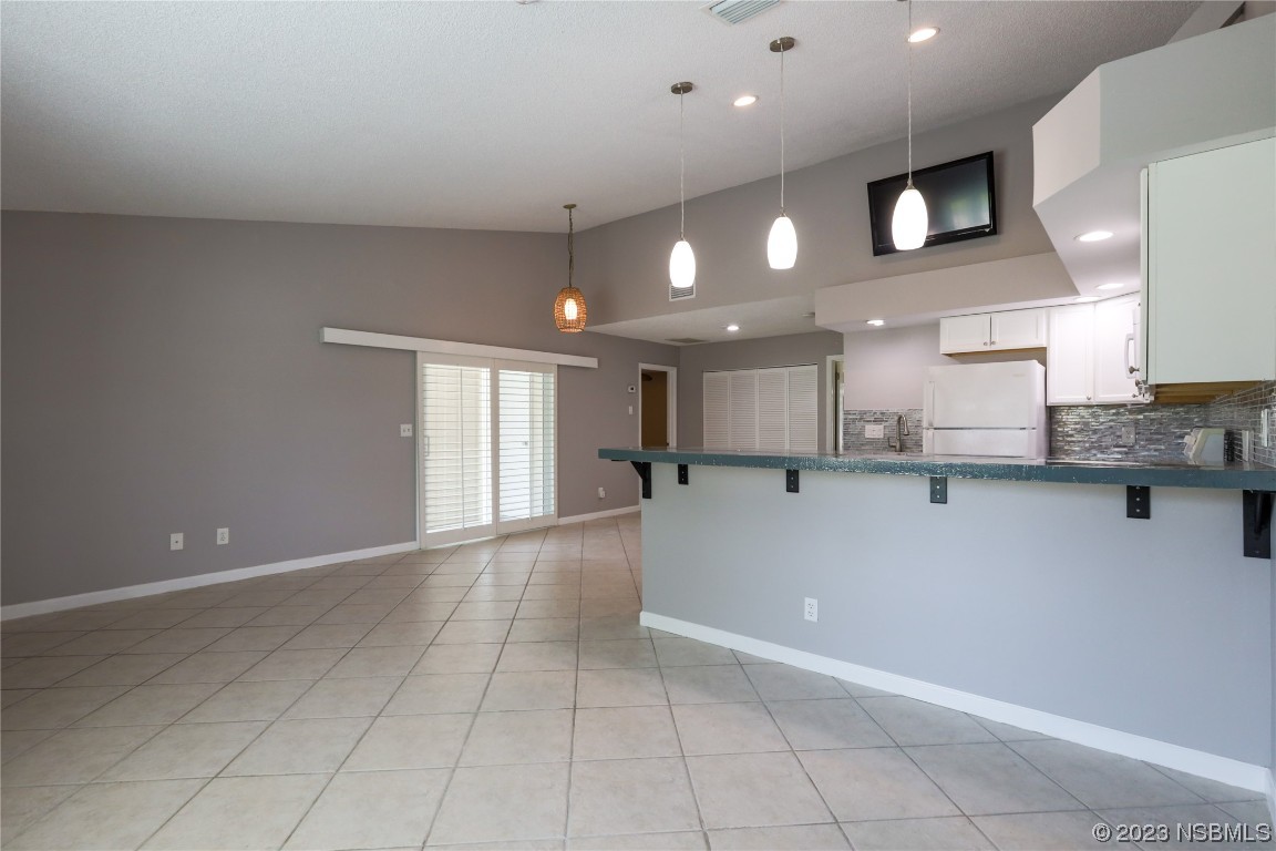 14 Chip Lane New Smyrna Beach, FL 32168 - Photo 8 of 54 a view of a kitchen with a sink and cabinets