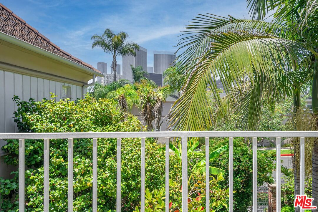360 South Roxbury Drive Beverly Hills, CA 90212 - Photo 15 of 30 a view of a potted plants and sky from a balcony