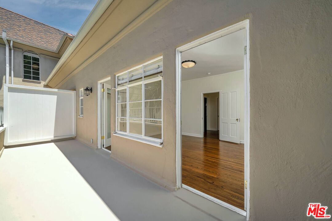 360 South Roxbury Drive Beverly Hills, CA 90212 - Photo 16 of 30 a view of empty room with window and front door