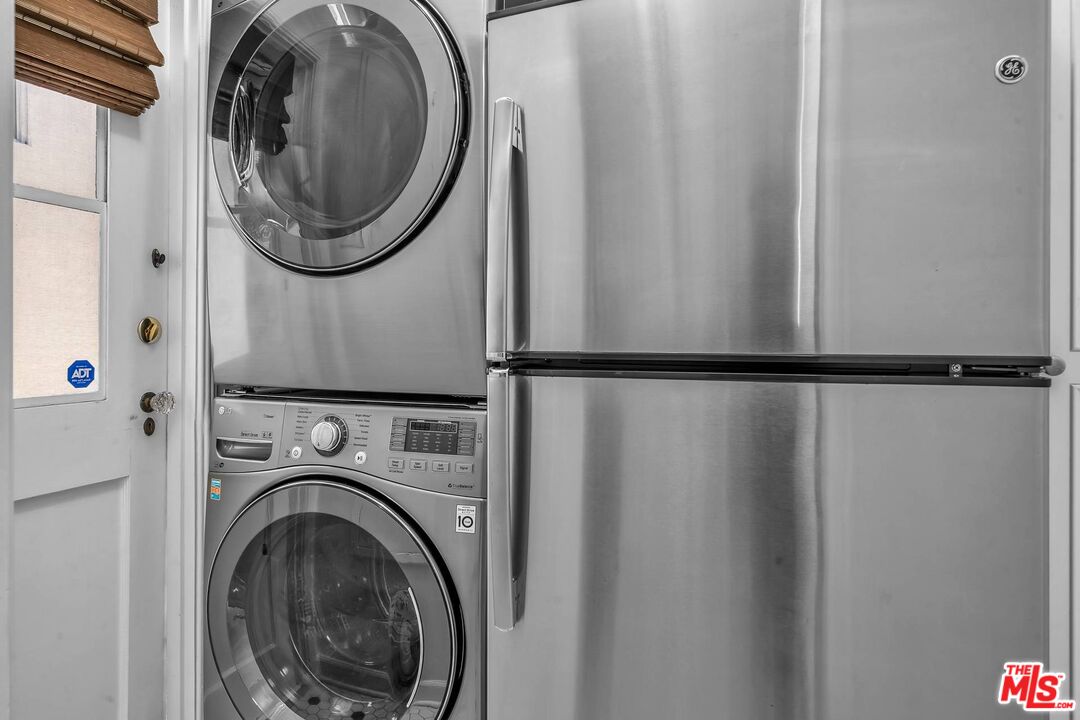 360 South Roxbury Drive Beverly Hills, CA 90212 - Photo 22 of 30 a utility room with dryer and washer