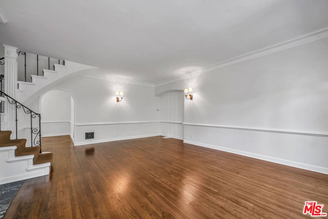 360 South Roxbury Drive Beverly Hills, CA 90212 - Photo 8 of 30 a view of empty room with wooden floor
