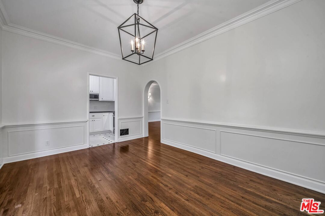 360 South Roxbury Drive Beverly Hills, CA 90212 - Photo 10 of 30 a view of empty room with wooden floor