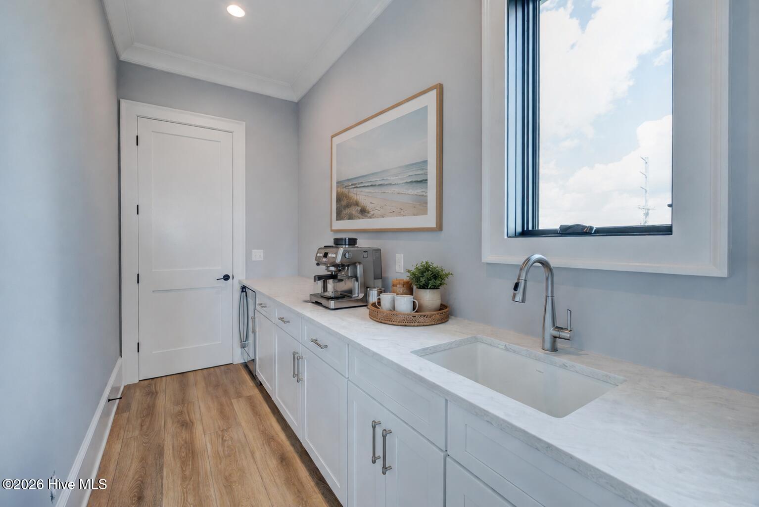 107 Raleigh Avenue Surf City, NC 28445 - Photo 4 of 40 private pantry off of kitchen. virtually furnished
