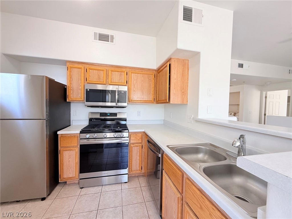 9050 West Warm Springs Road, Unit 2002 Las Vegas, NV 89148 - Photo 14 of 46 This functional kitchen provides a bright and efficient space for culinary endeavors.