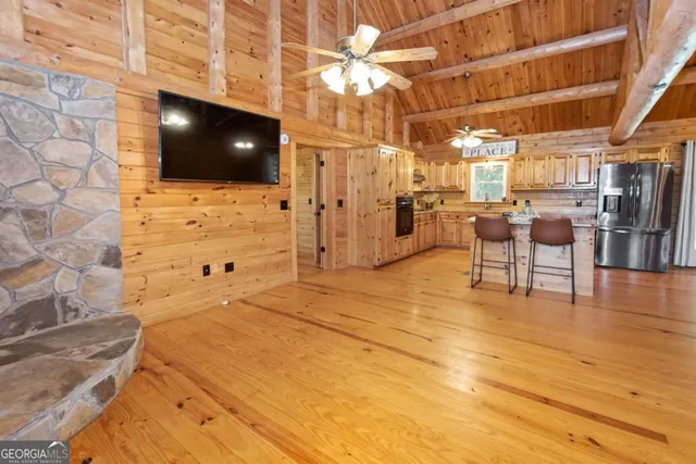 a bathroom with a granite countertop sink and a window