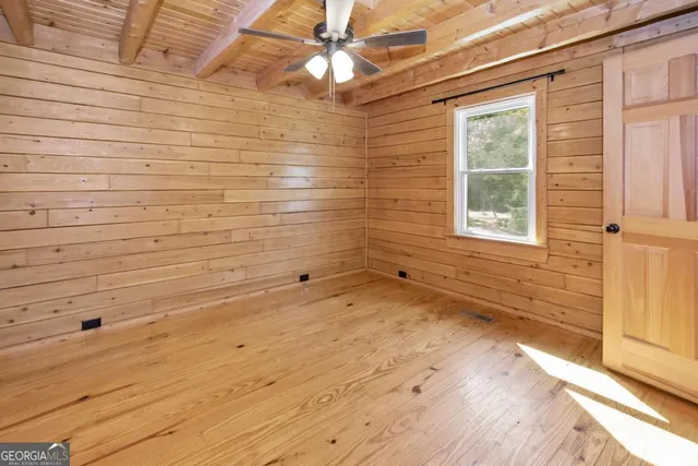 a view of a balcony with wooden floor