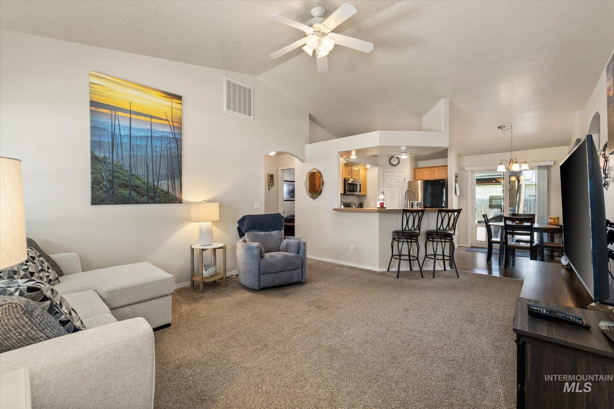 5401 Barkley Way Caldwell, ID 83607 - Photo 18 of 35 Vaulted ceilings complement the open-concept living space
