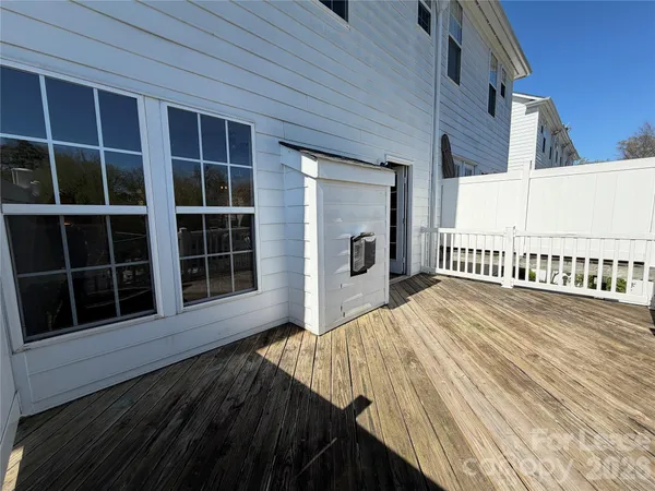 a outdoor space with wooden floor and windows