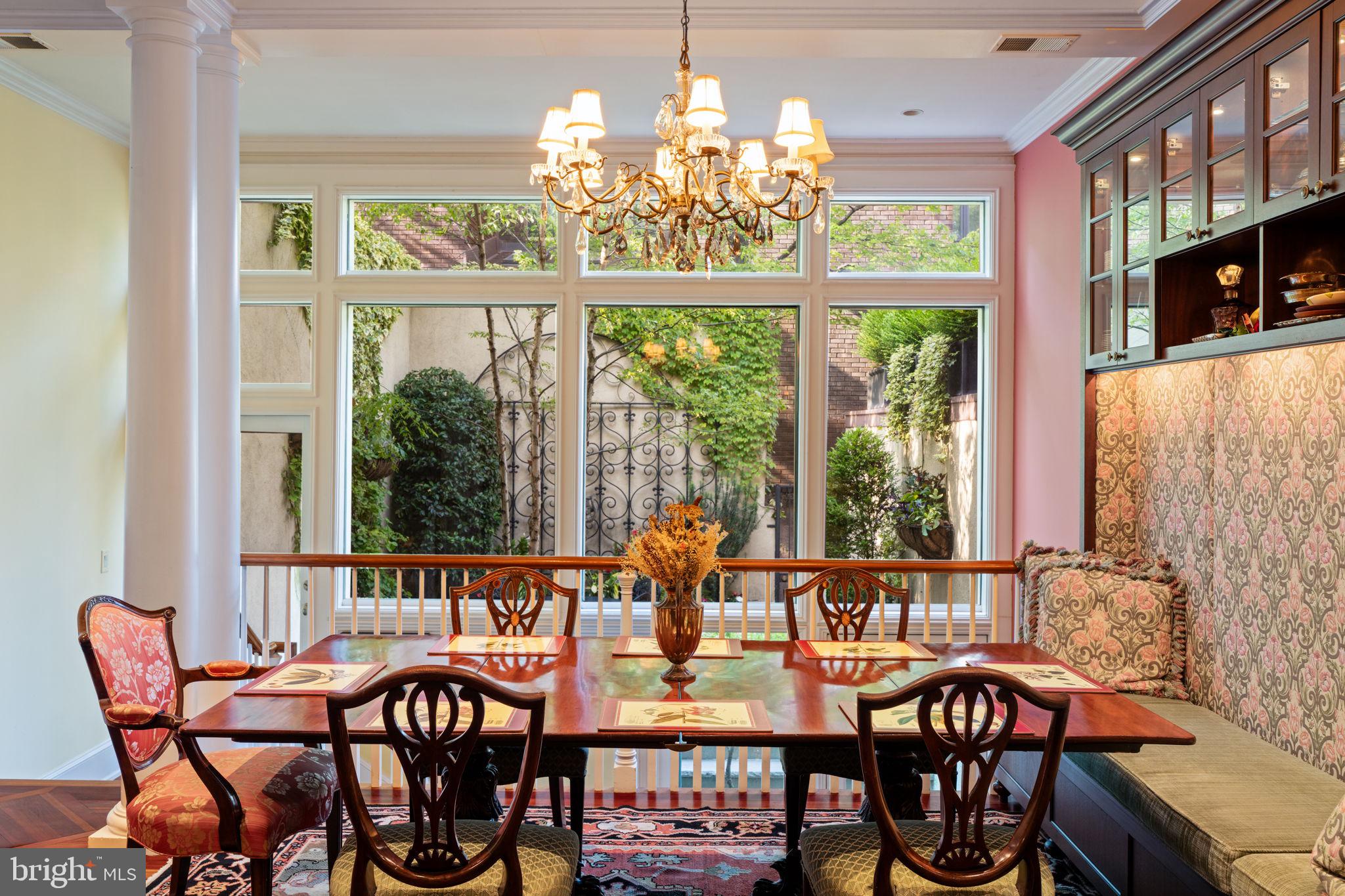 501 Pine Street Philadelphia, PA 19106 - Photo 15 of 52 a view of a dining room with furniture a chandelier and large windows
